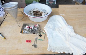 Vintage strainer, clothes pins including home made, bloomers all in a enamelware basin