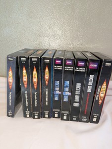 Doctor Who modern series box sets on DVD, spanning from Series 1 through Series 8, along with the David Tennant Specials box set