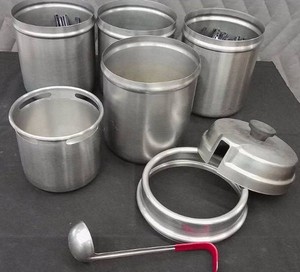 4 STAINLESS POTS FILLED WITH PLASTIC SILVERWEAR WITH EXTRAS