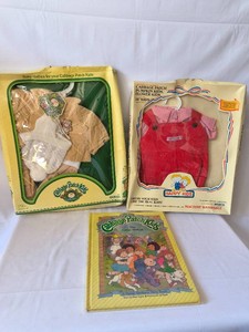 Cabbage Patch doll clothes and book