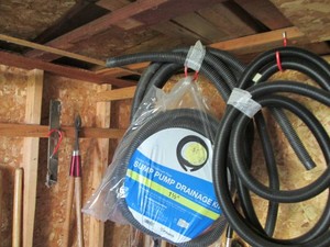 Collection of sump pump drainage, copper and mower blade