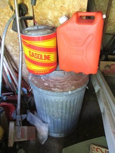 Variety of gas cans plus metal trash can with lid