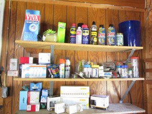 Large supply of replacement light bulbs, garage and outdoor supplies plus hardware