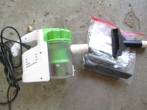 Handheld vacuum cleaner with attachments shown