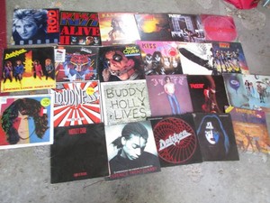 Vintage vinyl record albums from a variety of artists such as Kiss, Rod Stewart, Judah Priest, Buddy Holly, Motley Crue, ACDC and more