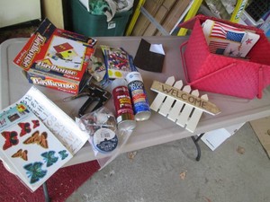 Vintage picnic basket full of assorted craft supplies