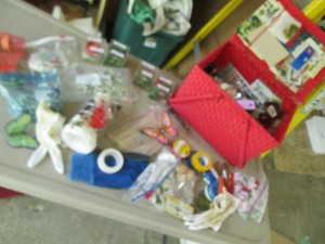Vintage picnic basket containing sewing notions and craft supplies