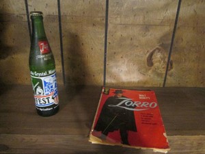 A vintage Zorro comic book and a commemorative 7up bottle
