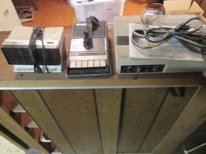 A vintage cassette recorder, telephone answering machine and a small heater