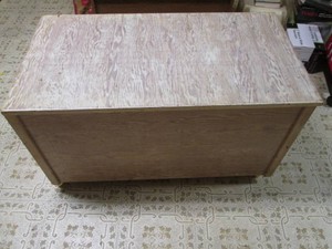 Chest containing crib or child sized linens
