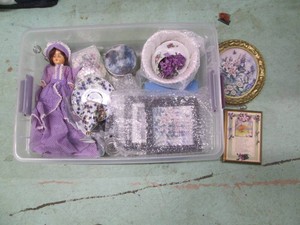 Tote with collectible china, a doll and other decor