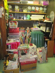 Massive collection of holiday items including gift wrap, bows and gift boxes