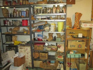 Contents of 3 shelves shown. Items included are jars of nails and screws, small storage bins and more