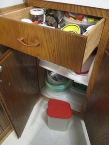 Large variety of food storage containers with lids, Tupperware, measuring supplies and more