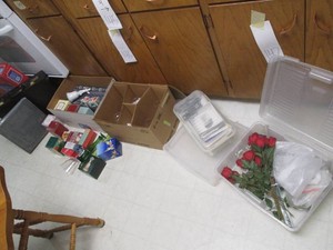 Collection of vintage Avon bottles, glass vases, faux flowers, lockable briefcase and more