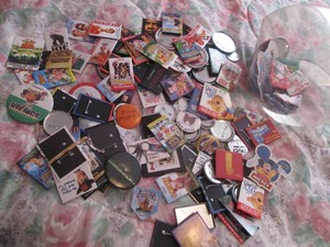 Collection of assorted collectible pin-on buttons