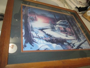 Snowy Cabin over the foot bridge near the Church Franed print by Iverson