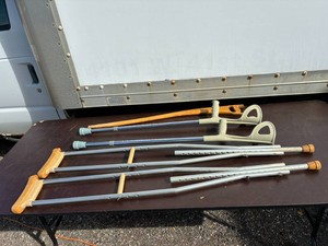 Two Crutch Sets and Wooden Cane