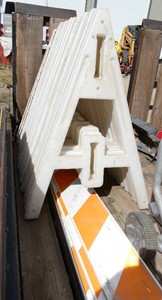 Ten 42 inch tall plastic barricade stands and two 8 ft long rails