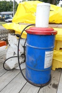 Pneumatic Greaser Unit with retractable hose and a bunch of grease