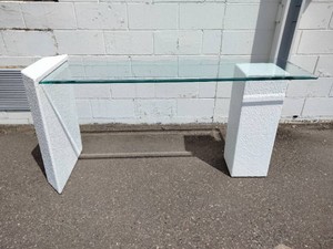 Vintage postmodern textured console table with a clear glass top and a sculpted white stucco or plaster finish base