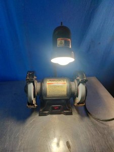 6-inch bench grinder with an integrated flexible work light,