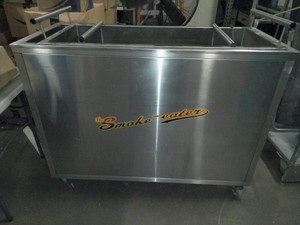 The Smoke-eater commercial barbecuegrill cart with built-in smoke filtration.
