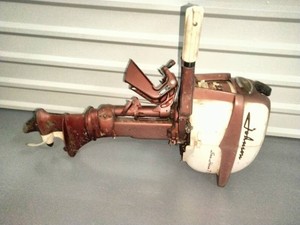 A vintage K&O Johnson Sea-Horse outboard motor from the 1950s