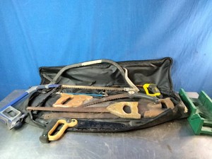 Collection of mixed vintage and modern hand saws,