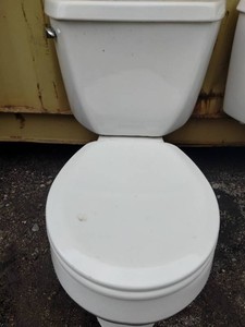 Standard Kohler two-piece porcelain flush toilet featuring a classic white tank, bowl, and closed lid.