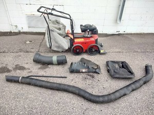Echo Bear Cat WV190  WV190S gas-powered vacuum with detached accessory hoses and collection parts laid out in front