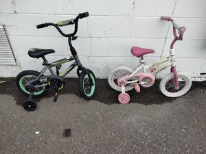 Two 12-inch childrens bicycles with training wheels