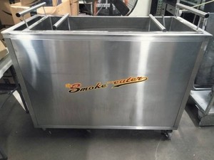 The Smoke-eater commercial barbecuegrill cart with built-in smoke filtration.