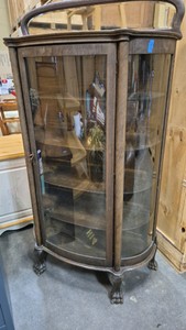 antique curved-glass curio cabinet
