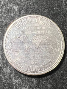 1 TROY OZ .999 FINE SILVER WORLD TRADE ROUND