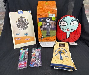 Large lot of Nightmare on Halloween decorations, Jack Skellington inflatable pillow, has dispenser, Halloween kitchen towels, and more