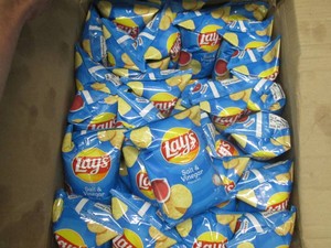 62 Bags Lays salt and vinegar chips dated Aug 25