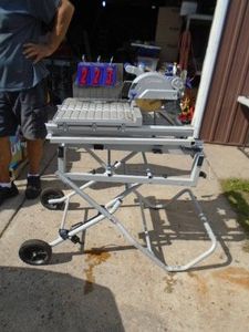 Kobalt tile saw on stand. Works. No miter included. As shown.