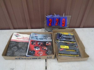 Small engine manuals & staplers. As shown.