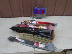 Assortment of lawn mower blades. As shown.