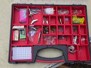 Lot of assorted hardware items including screws, nails, hooks, staples