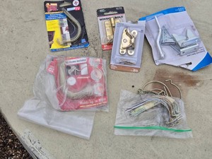 Assorted Hardware Items Including Picture Hangers, Window Bolt, Sash Lock, and More