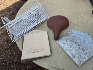 Lot including bicycle seat, rack organizer, and galvanized metal mail organizer