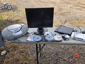 Electronics Lot including LG Monitor, Sony DVD Player, and Assorted Dvds