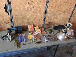 Household Tools and Supplies Assortment including Lamps, Screws, and Safety Gear