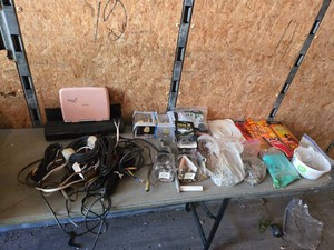 Miscellaneous household and hardware items including Defiant Brandywine BedBath Doorknob, Philips Portable DVD Player, Tilejax spacers, Fas-Tac Headliner Repair Pins