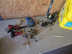 Assorted Tools and Outdoor Gear including Fishing Accessories, Sports Radio, and Power Cables