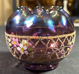 VINTAGE Fenton Plum Carnival Glass Rose Bowl from 1995, featuring a hand-painted floral design with an iridescent purple finish and raised gold lattice accents.