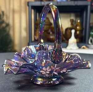 VINTAGE Fenton iridescent amethyst carnival glass ruffled basket with a hand-painted floral design by T. Watson, featuring a signature attributed to Bill Fenton.