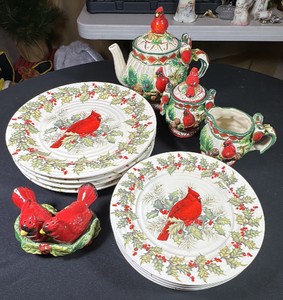 Cracker Barrel Plaid Tidings ceramic dish set. Dinner Plates (4) Salad Plates (4) Tea Pot, Creamer, Sugar Bowl, Salt & Pepper Shaker. Featuring a bright red cardinal perched on holly branches.